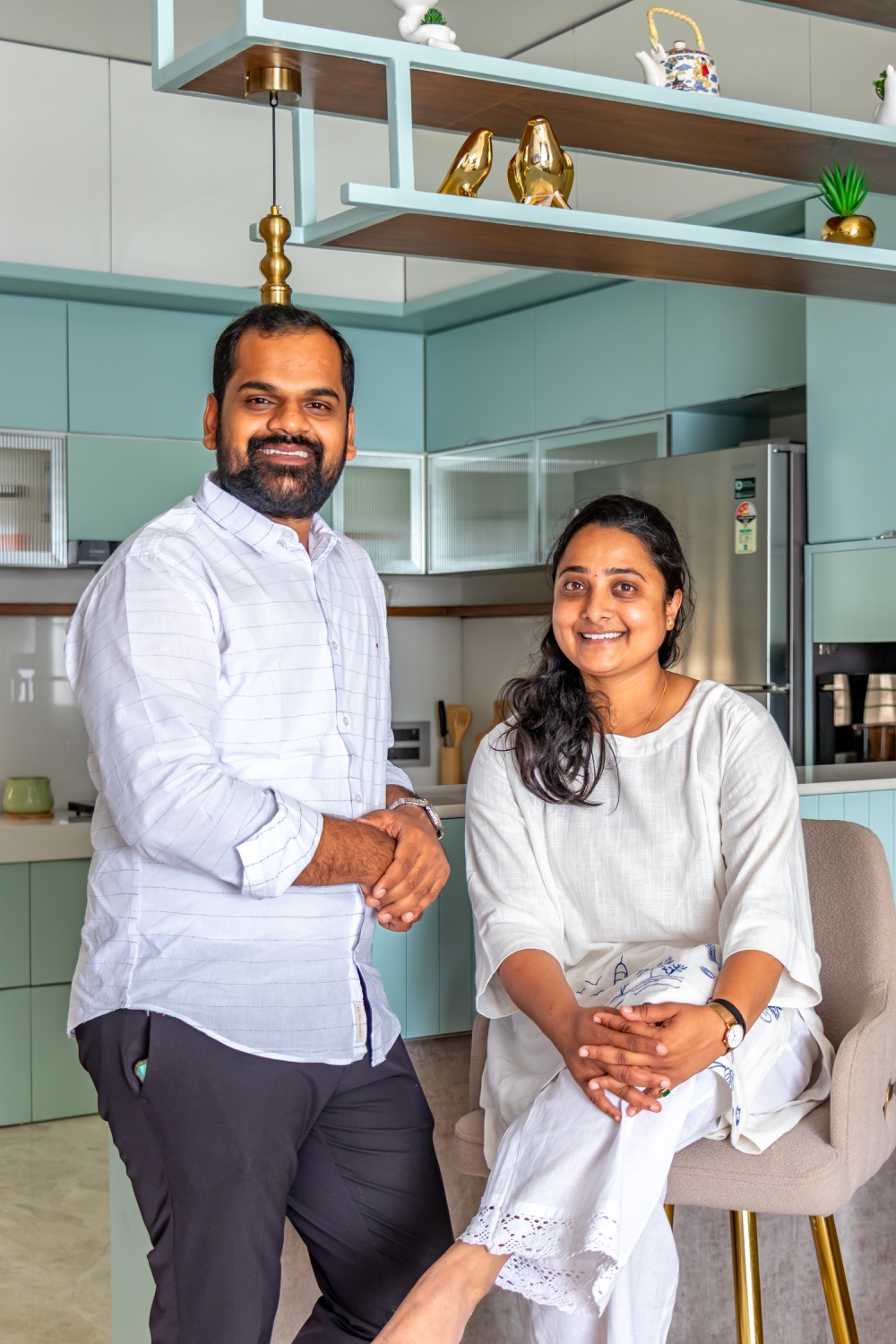 The founders in a pastel-green kitchen interior